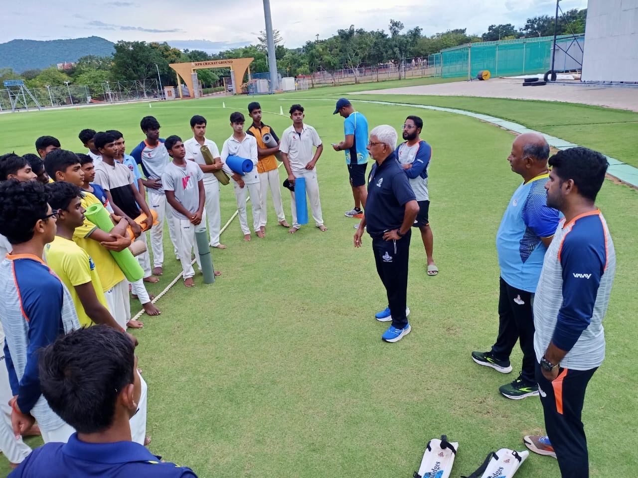 Tarun addressing players in a training-ground huddle